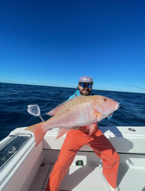 a man holding a large fish